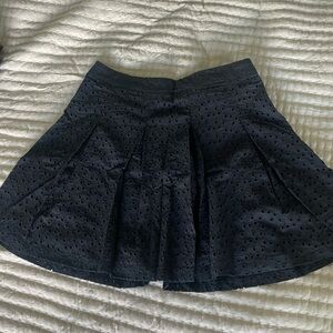 Black pleated skirt with eyelet details JustFab size XS